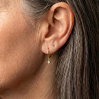 An Elegant Minimalist Gold Drop Huggie Earring Set